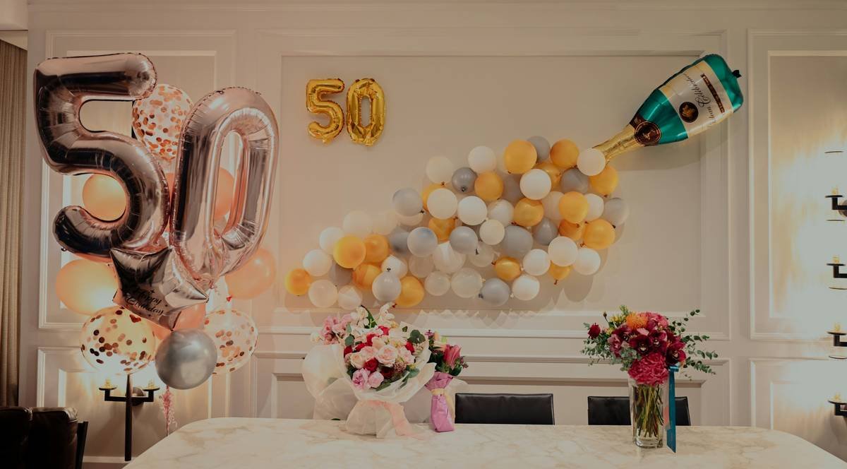 Bar chart showing 68% of Americans celebrate anniversaries at home with simple decor like balloons