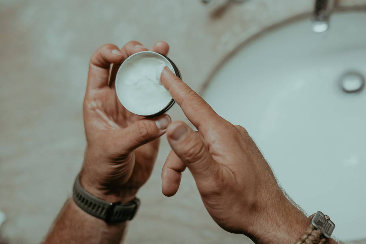 Infographic showing 3-layer hydration system: humectants (glycerin), emollients (squalane), occlusives (shea butter) working together in effective body moisturizers