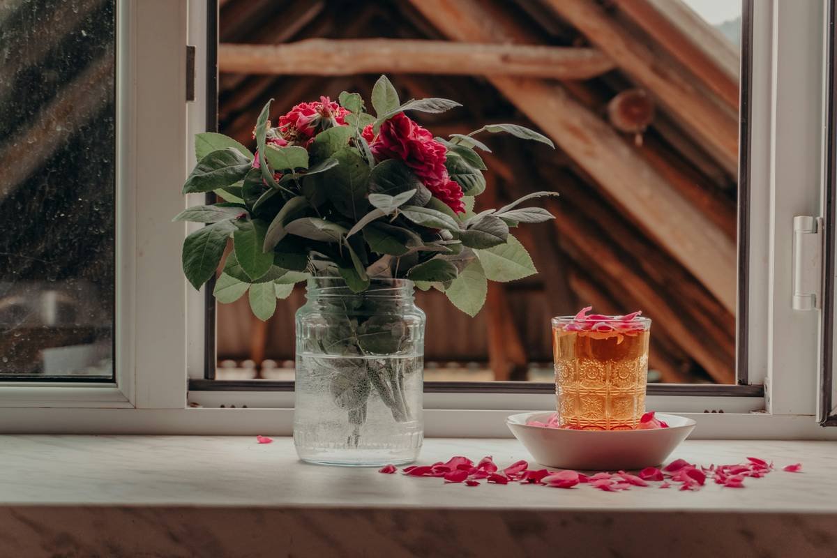 how to make anniversary decorations using photo strings and fairy lights on a rustic wooden wall